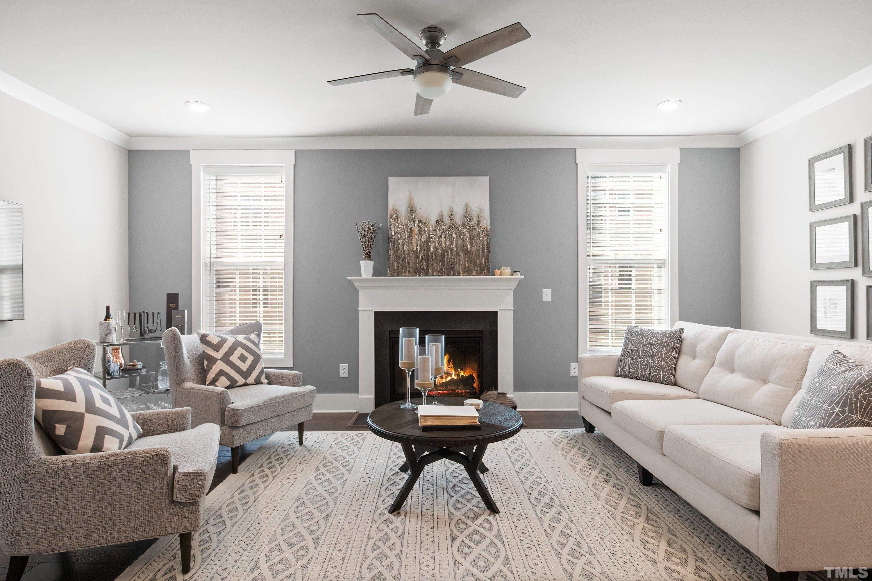 10330 Sablewood Drive, Unit 110 Raleigh, NC 27617 - Photo 11 of 58 a living room with furniture and a fireplace