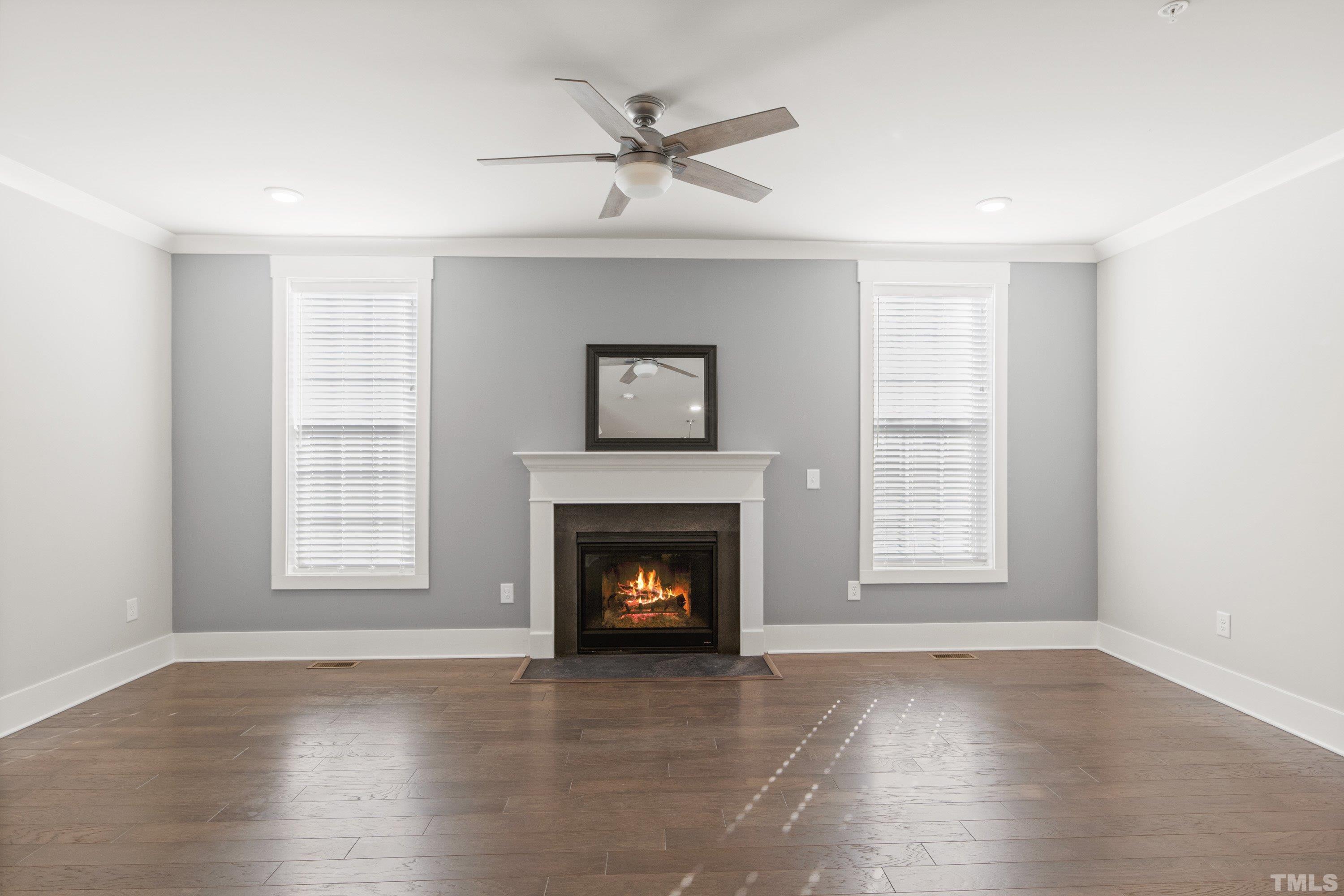 10330 Sablewood Drive, Unit 110 Raleigh, NC 27617 - Photo 12 of 58 an empty room with windows and fireplace