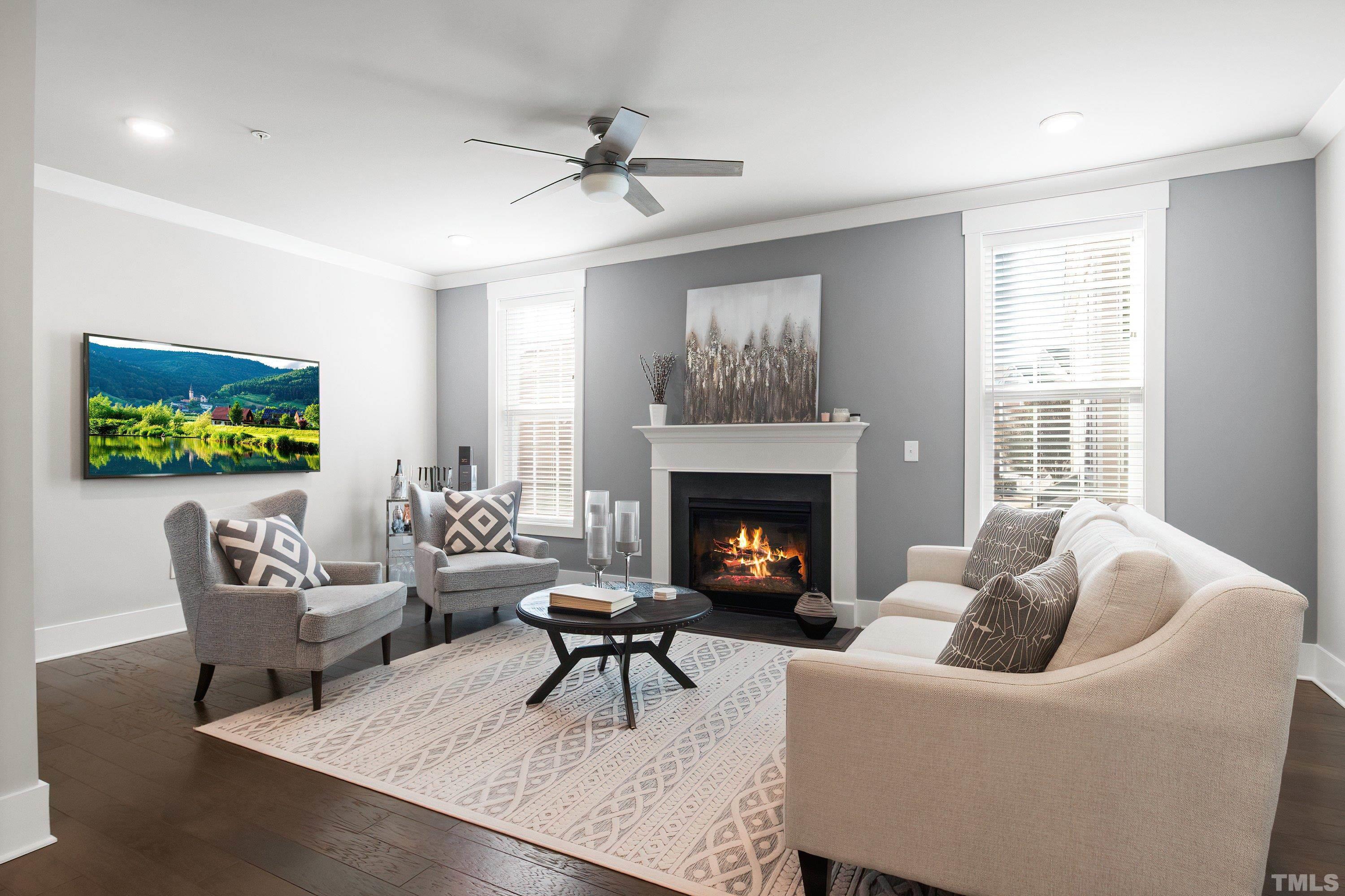 10330 Sablewood Drive, Unit 110 Raleigh, NC 27617 - Photo 13 of 58 a living room with furniture and a fireplace