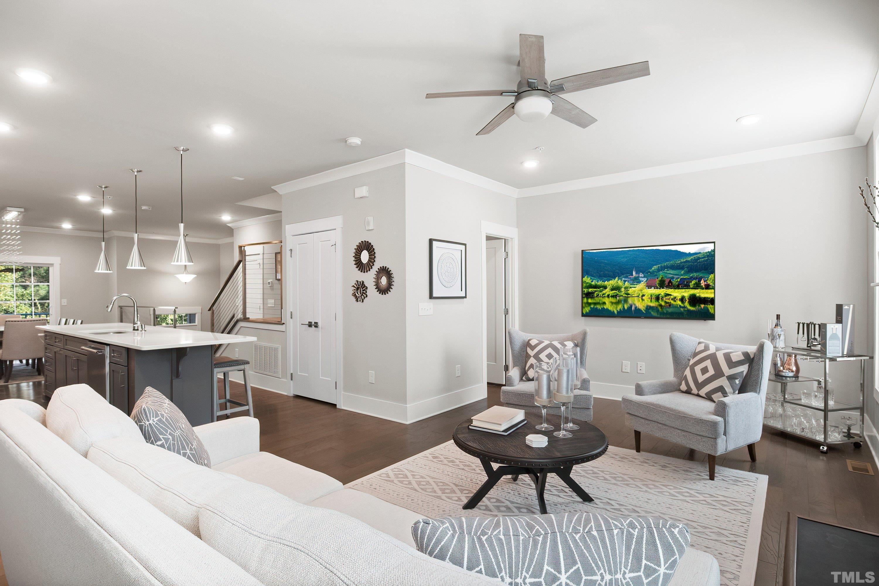 10330 Sablewood Drive, Unit 110 Raleigh, NC 27617 - Photo 16 of 58 a living room with furniture and a wooden floor