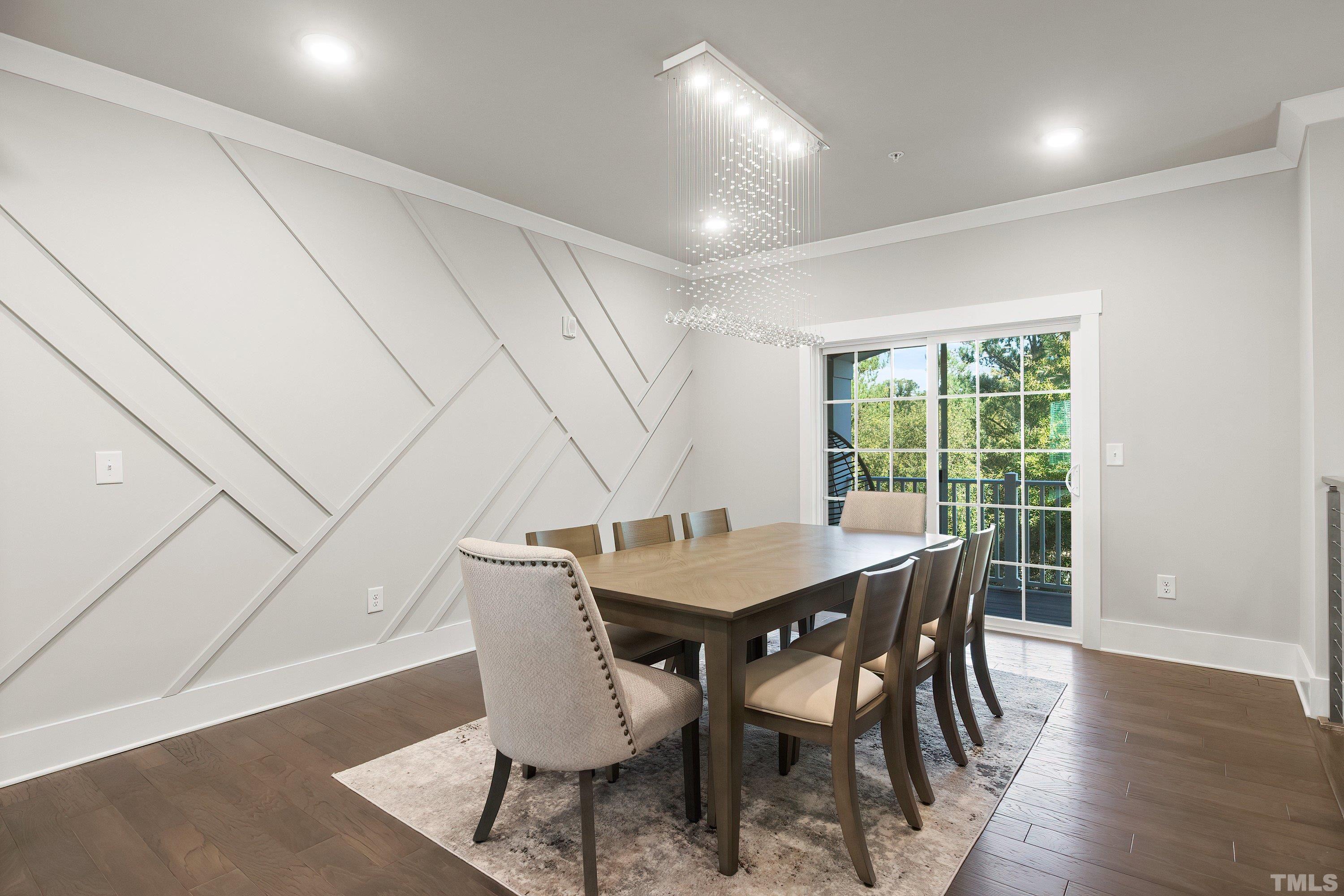 10330 Sablewood Drive, Unit 110 Raleigh, NC 27617 - Photo 22 of 58 a view of a dining room with furniture window and wooden floor