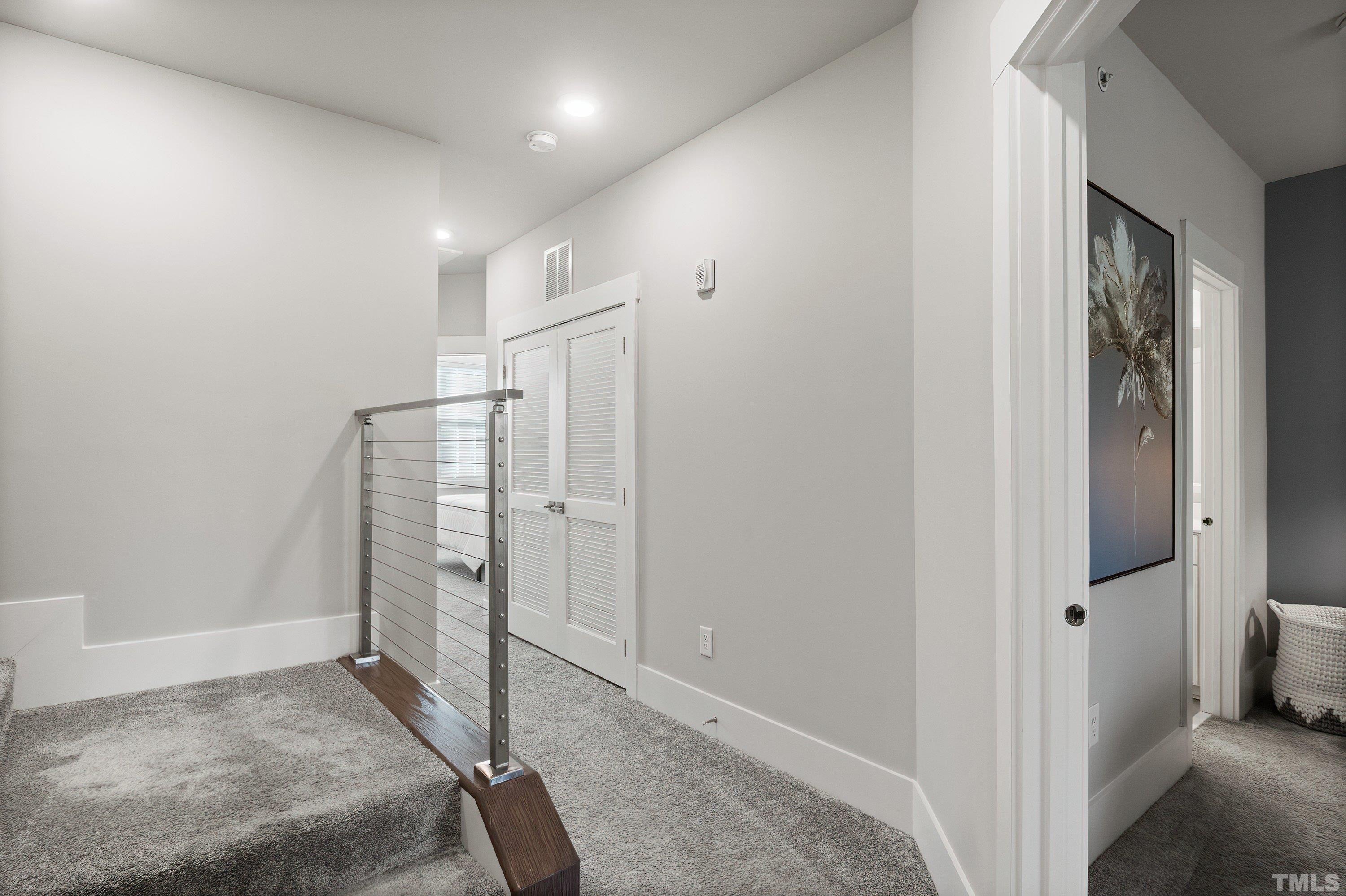 10330 Sablewood Drive, Unit 110 Raleigh, NC 27617 - Photo 28 of 58 a view of a hallway with wooden floor and entryway