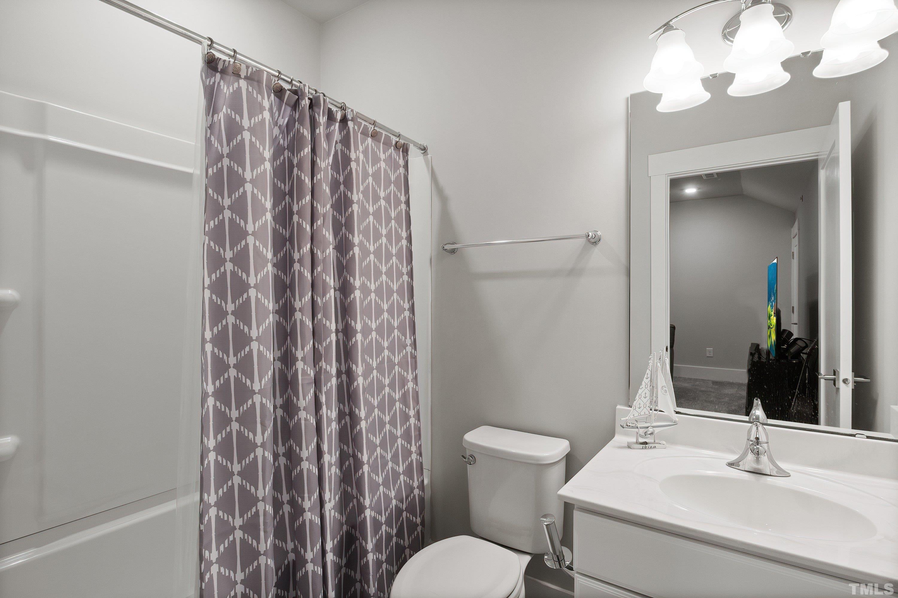 10330 Sablewood Drive, Unit 110 Raleigh, NC 27617 - Photo 41 of 58 a bathroom with a sink toilet and shower