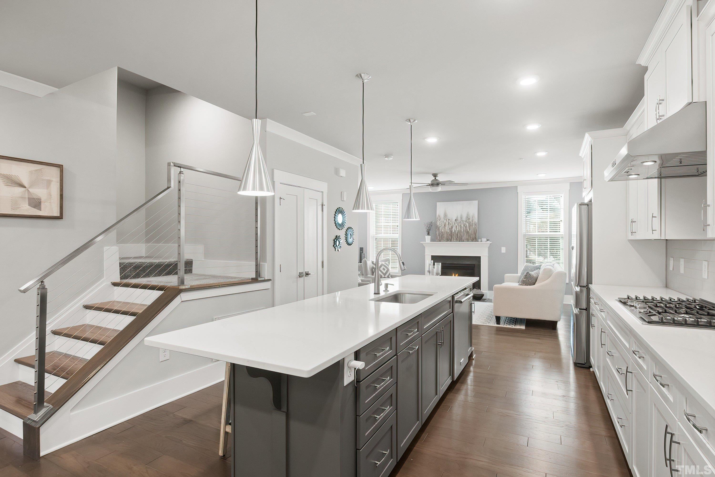 10330 Sablewood Drive, Unit 110 Raleigh, NC 27617 - Photo 6 of 58 a kitchen with counter top space sink stove and refrigerator