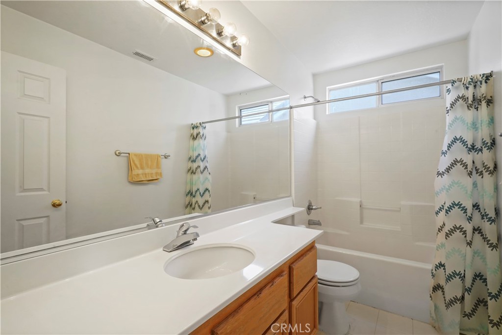 28445 Silverking Trail Saugus, CA 91390 - Photo 30 of 54 a bathroom with a granite countertop sink toilet and shower