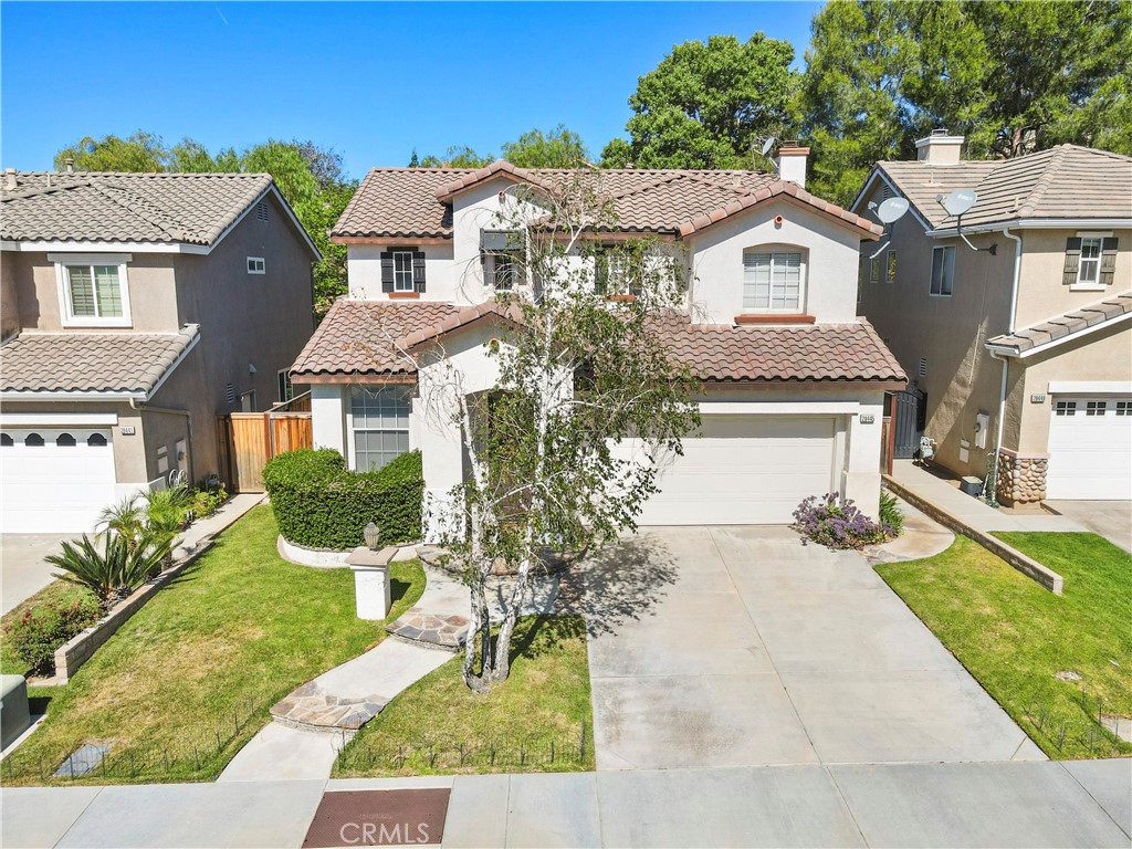 28445 Silverking Trail Saugus, CA 91390 - Photo 6 of 54 a front view of a house with a yard