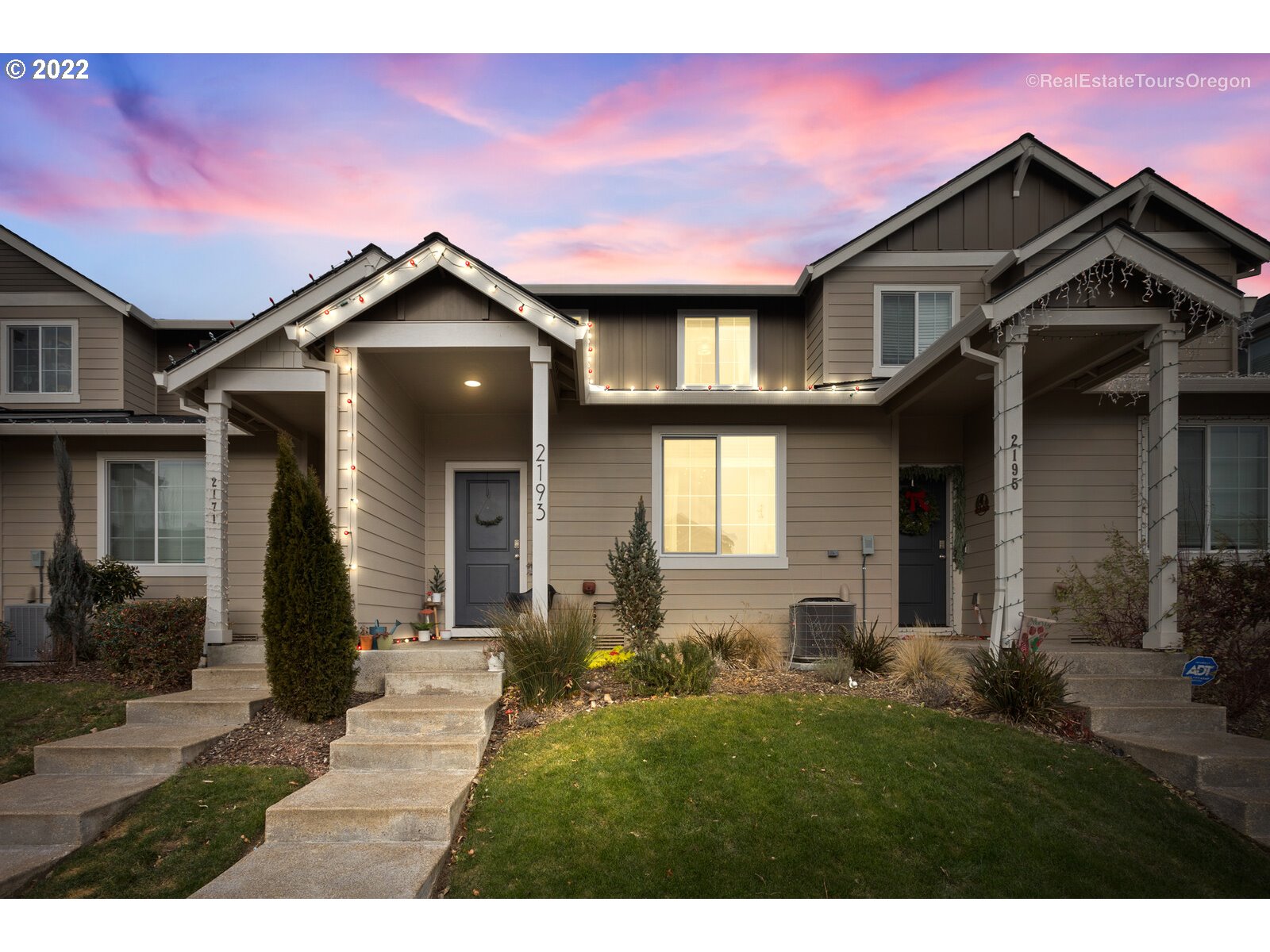 a front view of a house with a yard