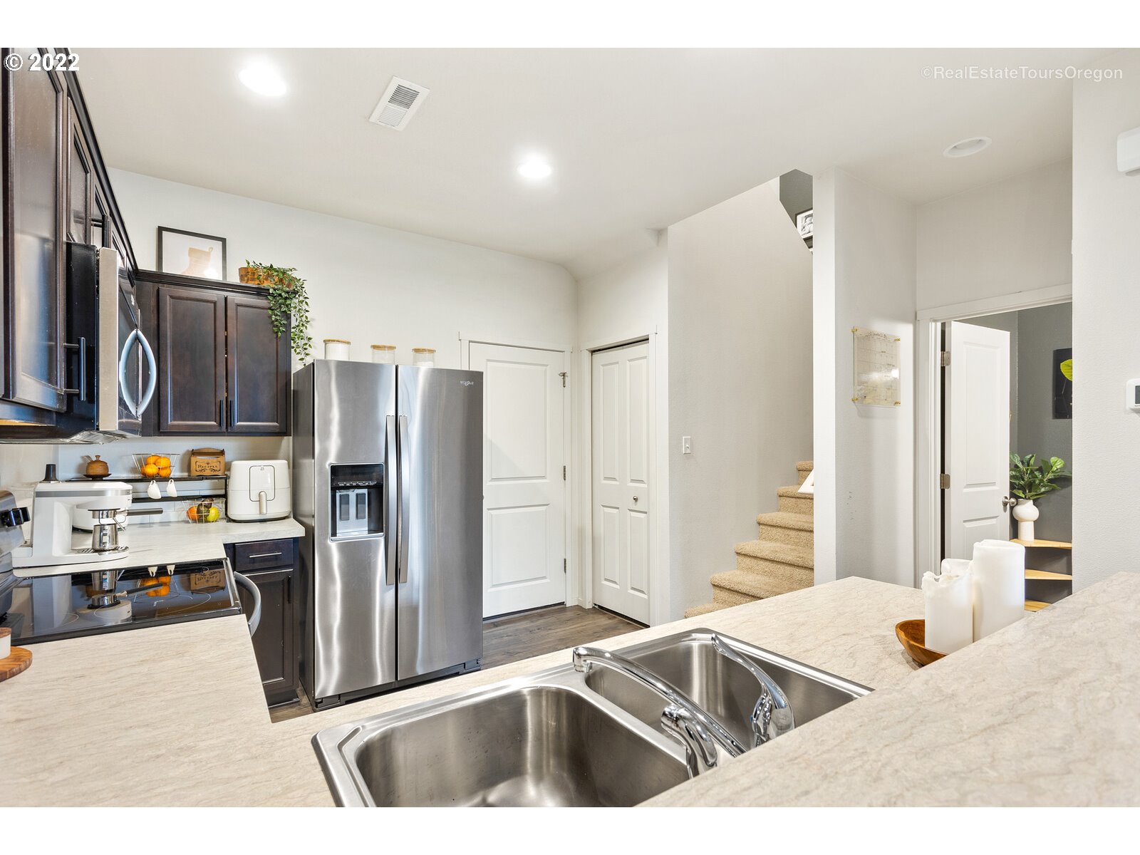 2193 Southeast 16th Street Gresham, OR 97080 - Photo 11 of 32 a kitchen with stainless steel appliances kitchen island granite countertop a refrigerator and a sink