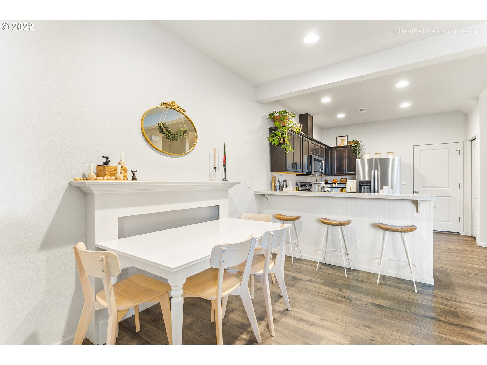 2193 Southeast 16th Street Gresham, OR 97080 - Photo 14 of 32 a kitchen with a dining table chairs and white cabinets