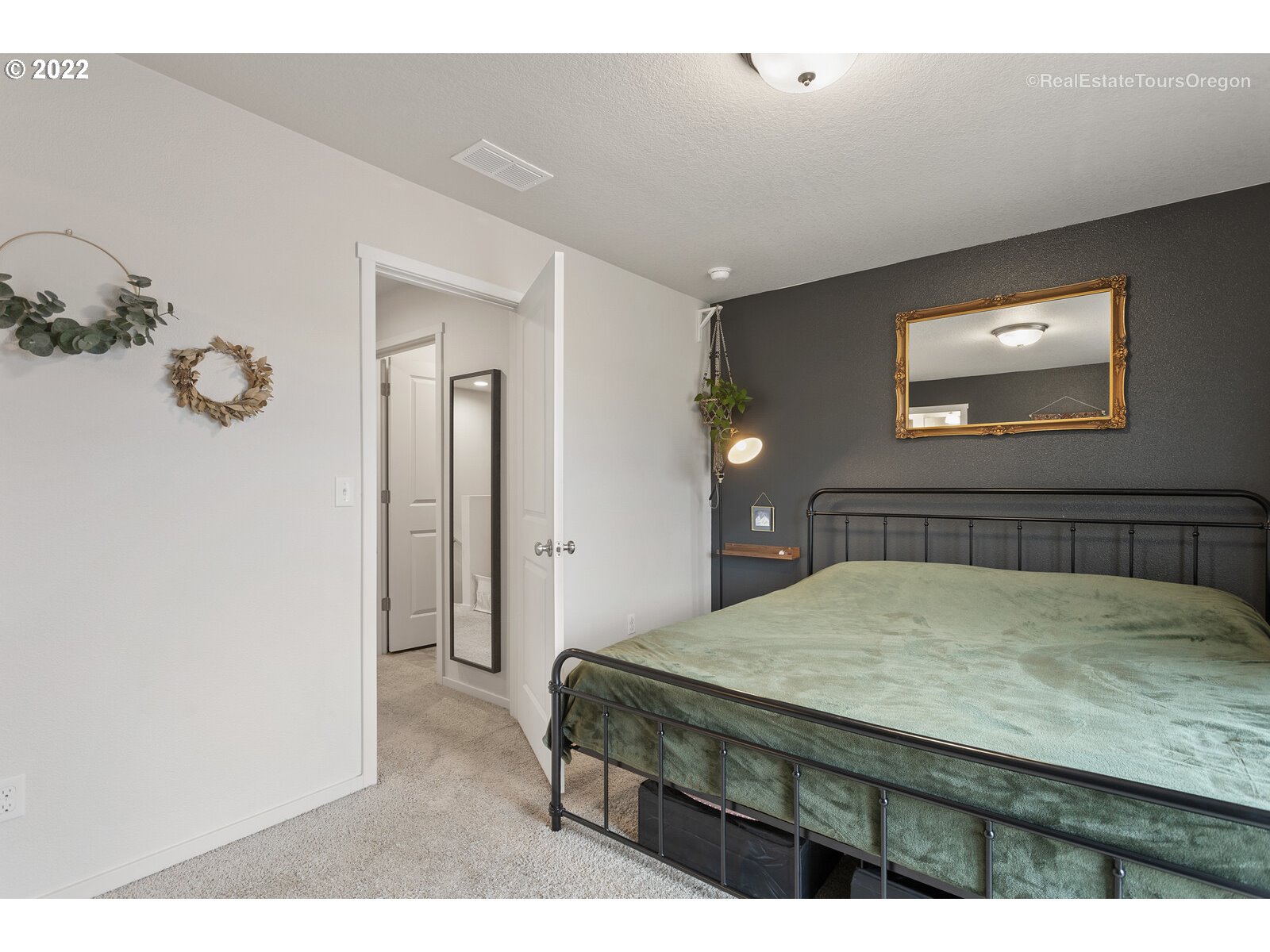 2193 Southeast 16th Street Gresham, OR 97080 - Photo 21 of 32 a bedroom with a bed and a table