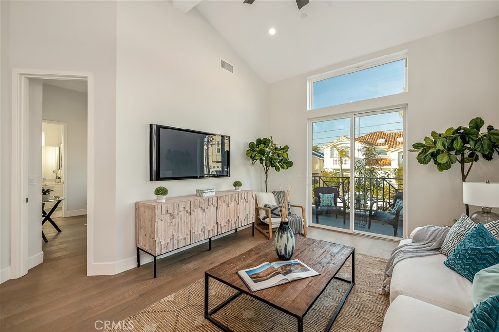 2016 Clark Lane, Unit A Redondo Beach, CA 90278 - Photo 15 of 30 a living room with furniture and a flat screen tv