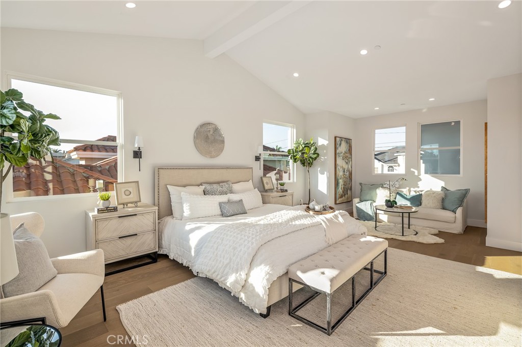 2016 Clark Lane, Unit A Redondo Beach, CA 90278 - Photo 18 of 30 a bedroom with a large bed and a large window