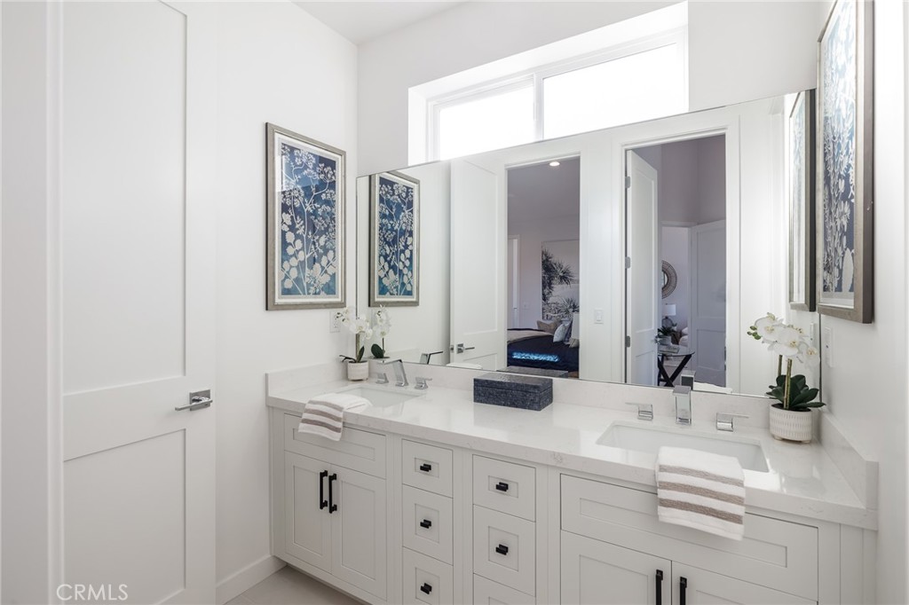 2016 Clark Lane, Unit A Redondo Beach, CA 90278 - Photo 27 of 30 a bathroom with double vanity sink and a mirror