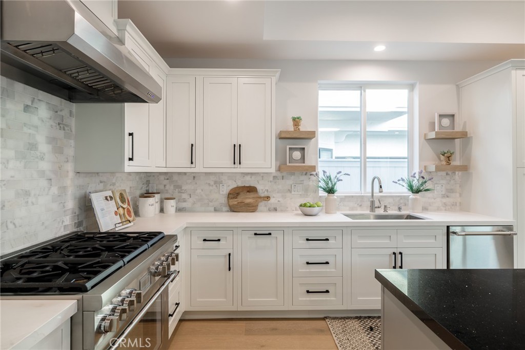 2016 Clark Lane, Unit A Redondo Beach, CA 90278 - Photo 10 of 30 a kitchen with stainless steel appliances a sink a stove and a window