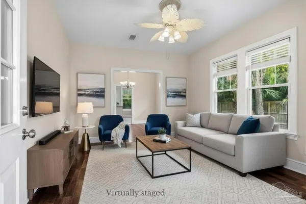 a view of a dining room with furniture window and wooden floor