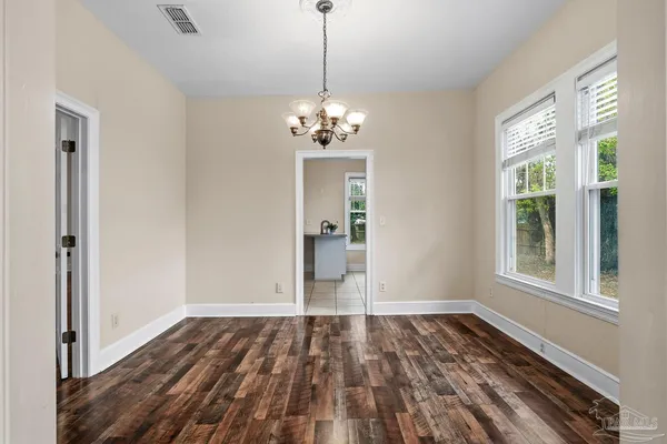 a kitchen with a sink cabinets and window