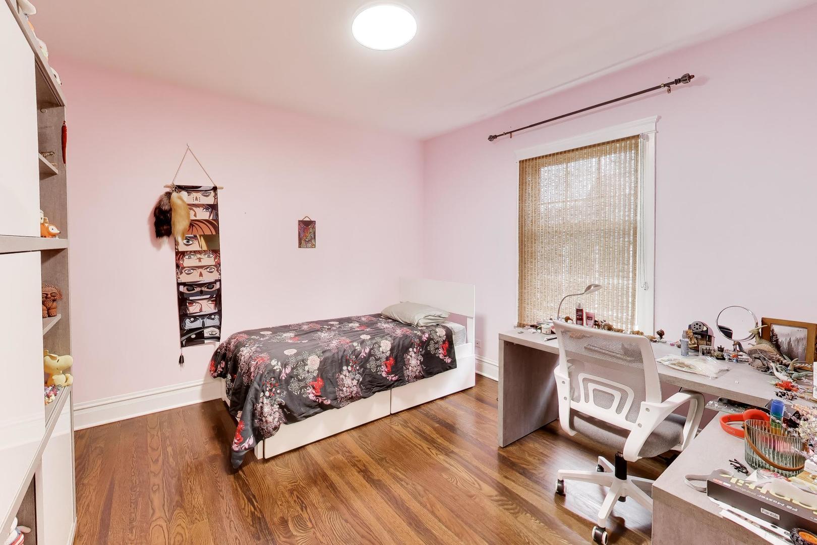 274 Oak Street Elmhurst, IL 60126 - Photo 20 of 31 a bedroom with a bed and wooden floor