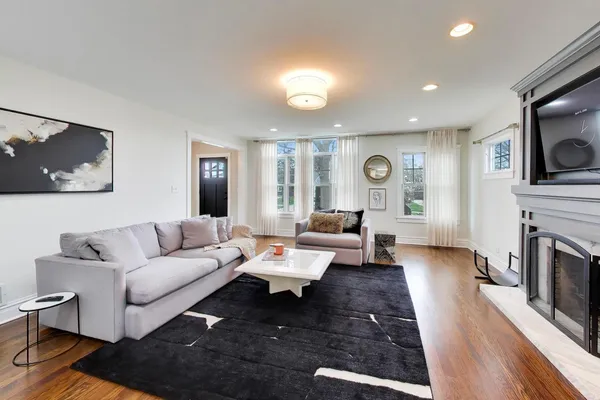 a living room with furniture and a fireplace