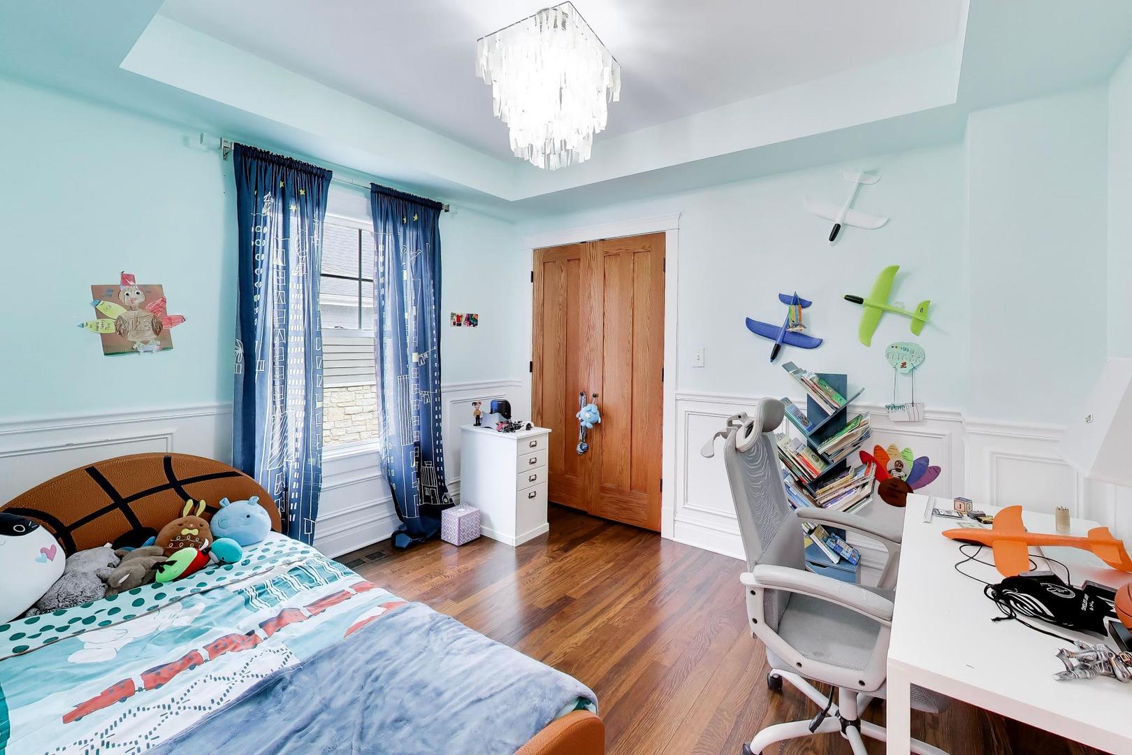 274 Oak Street Elmhurst, IL 60126 - Photo 21 of 31 a bedroom with a bed and wooden floor