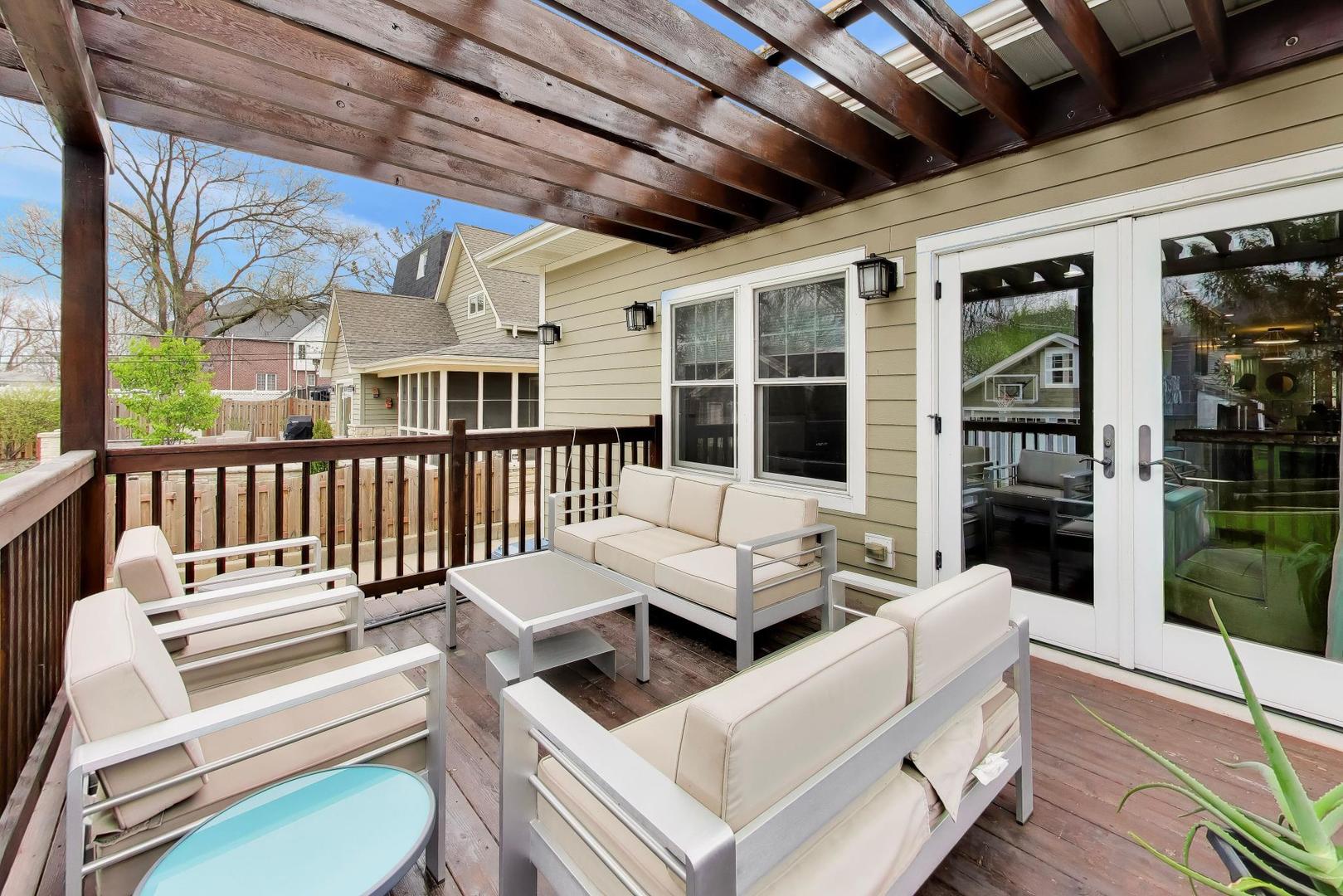 274 Oak Street Elmhurst, IL 60126 - Photo 28 of 31 a view of a deck with couches chairs with wooden floor and fence