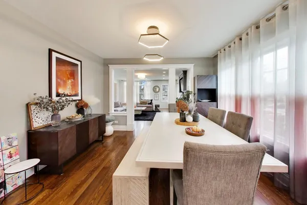 a view of a dining room with furniture window and wooden floor