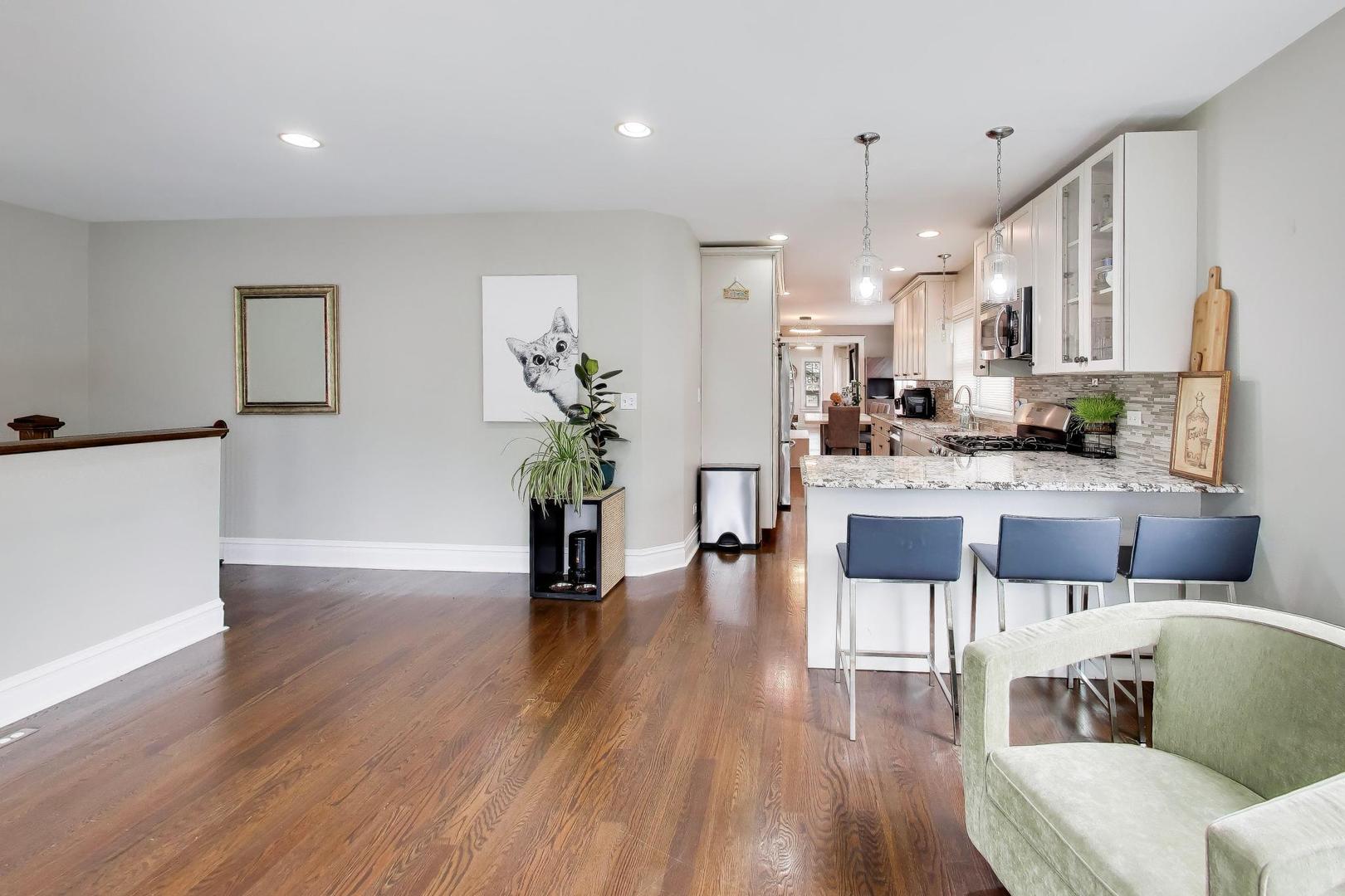274 Oak Street Elmhurst, IL 60126 - Photo 10 of 31 a living room with kitchen island furniture and a wooden floor