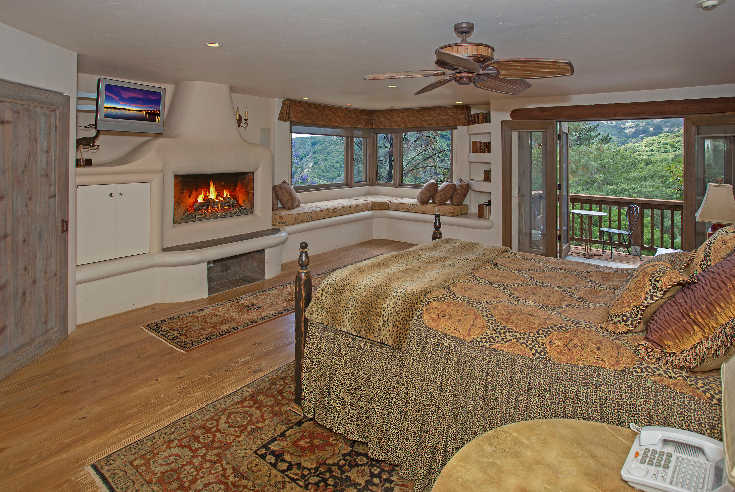 1090 Toro Canyon Road Santa Barbara, CA 93108 - Photo 13 of 28 a bedroom with a bed and a flat screen tv