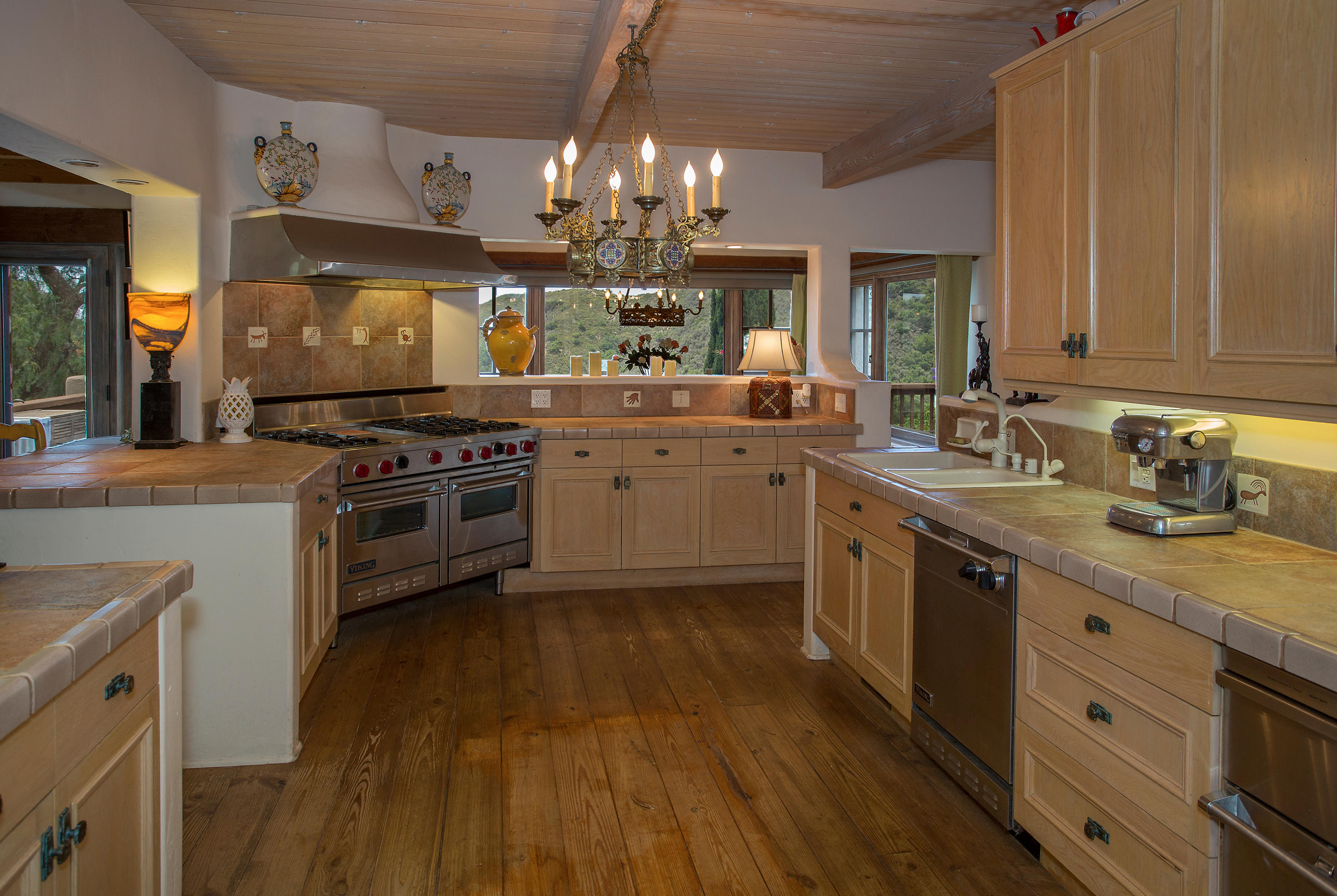 1090 Toro Canyon Road Santa Barbara, CA 93108 - Photo 14 of 28 a kitchen with stainless steel appliances a stove sink and cabinets