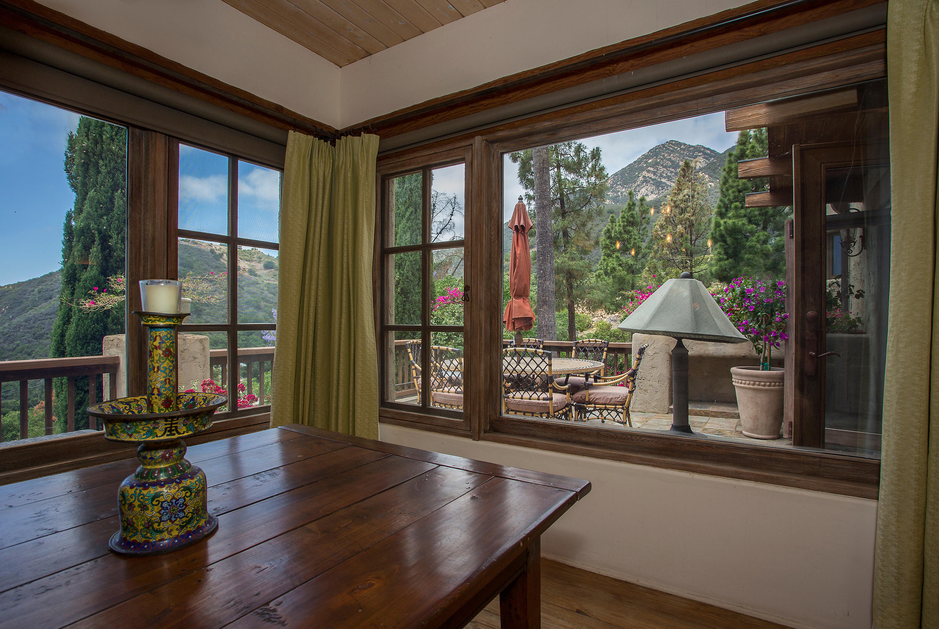 1090 Toro Canyon Road Santa Barbara, CA 93108 - Photo 15 of 28 a living room filled with furniture and a potted plant