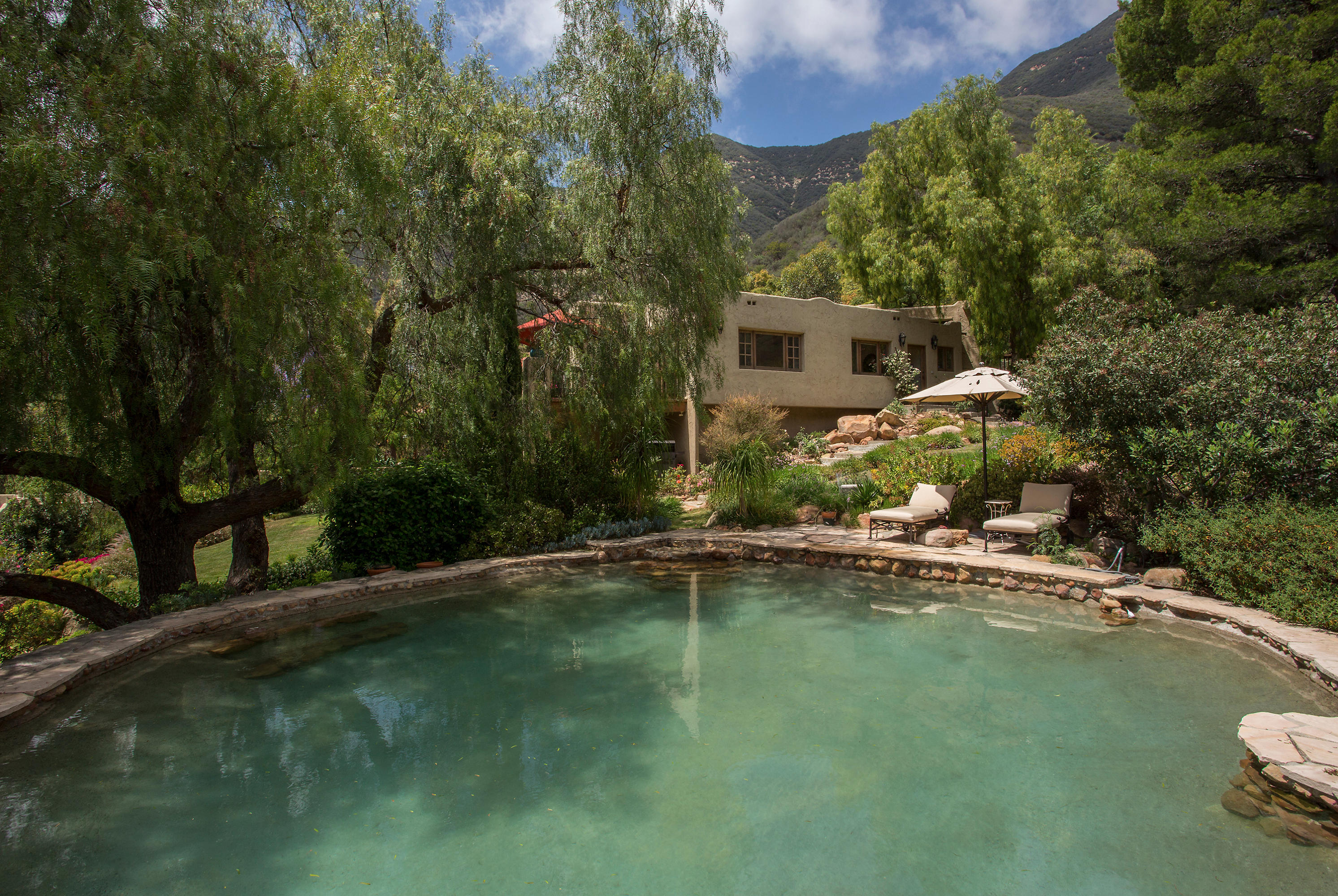 1090 Toro Canyon Road Santa Barbara, CA 93108 - Photo 24 of 28 a view of a swimming pool with a patio