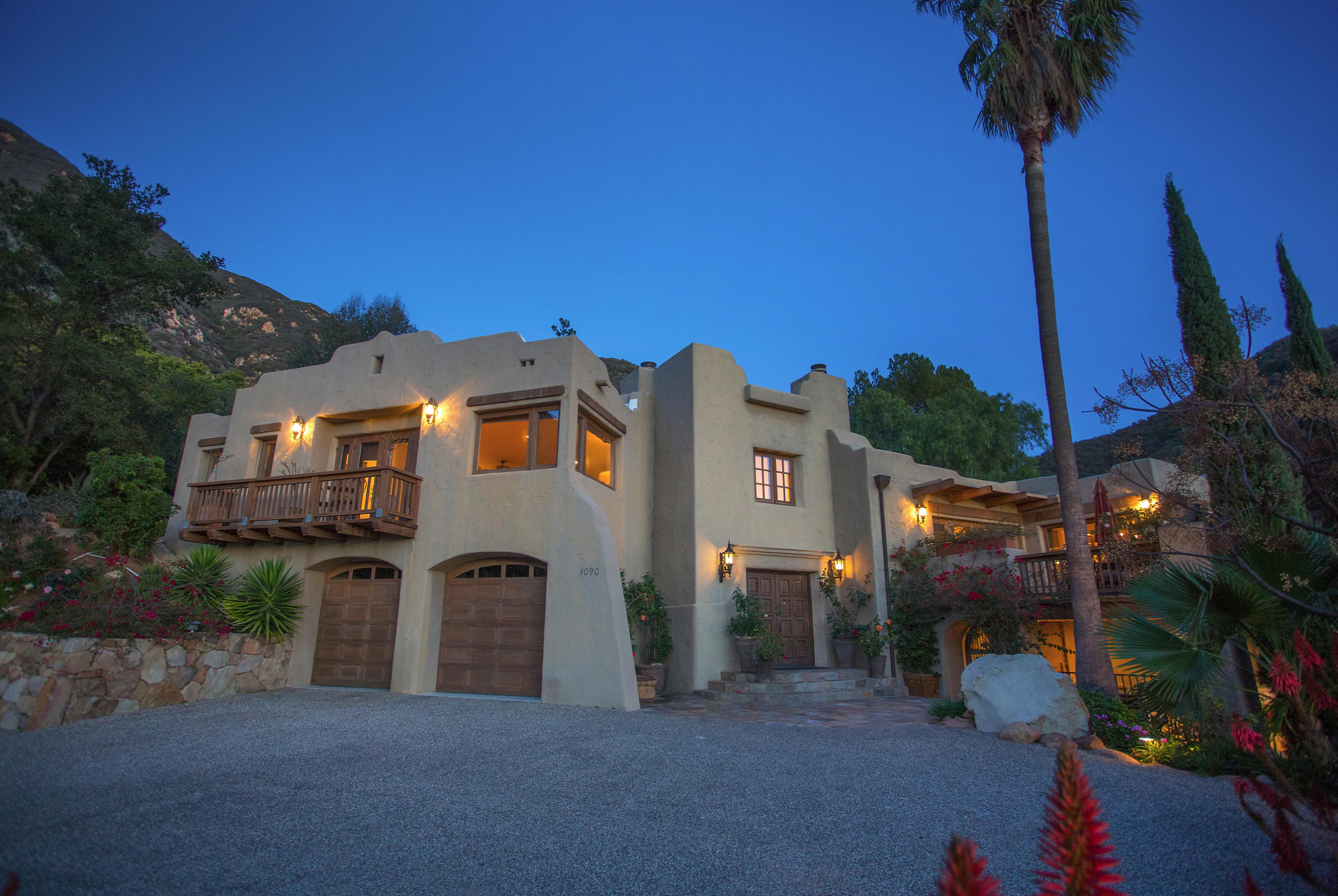 1090 Toro Canyon Road Santa Barbara, CA 93108 - Photo 4 of 28 a view of a house with a yard and potted plants