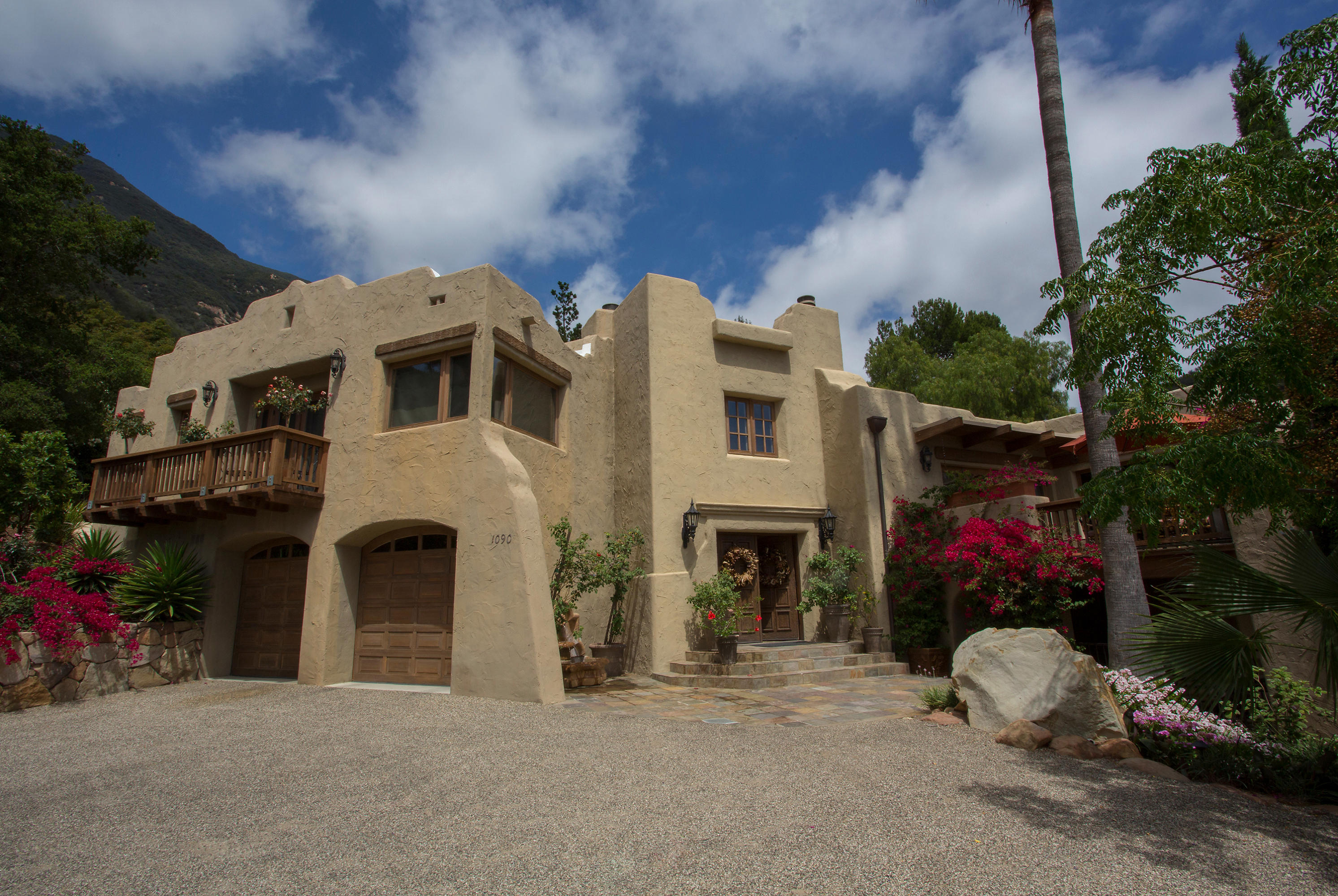 1090 Toro Canyon Road Santa Barbara, CA 93108 - Photo 8 of 28 a front view of a house with a garage