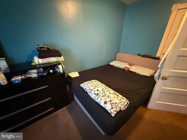 a bedroom with a bed and furniture