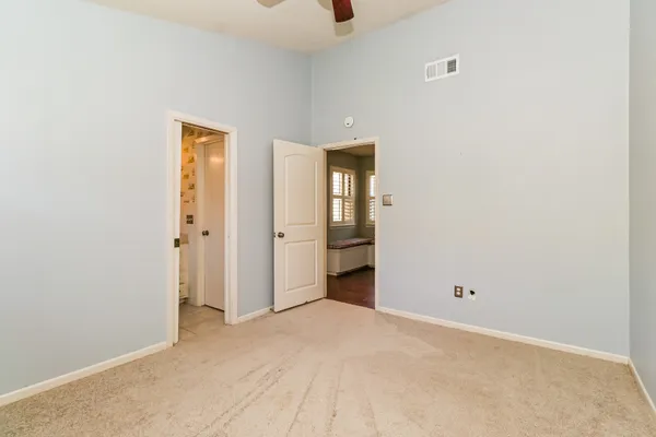 an empty room with an entryway door