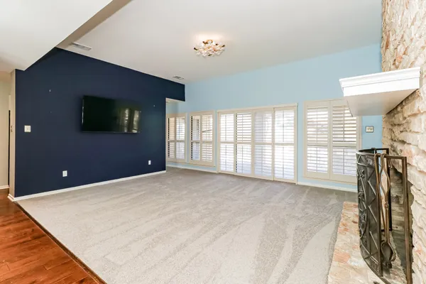 a view of a livingroom with furniture and a flat screen tv