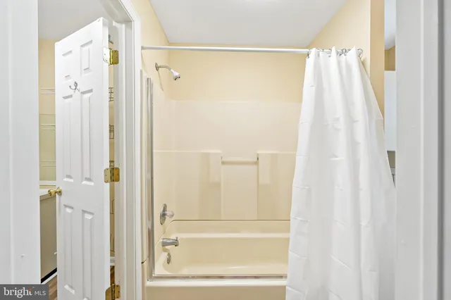 a bathroom with a shower and a tub