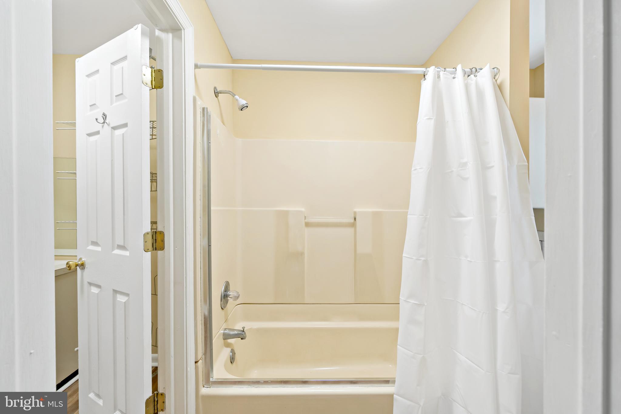 2537 South Broad Street, Unit 2 Philadelphia, PA 19148 - Photo 11 of 18 a bathroom with a shower and a tub