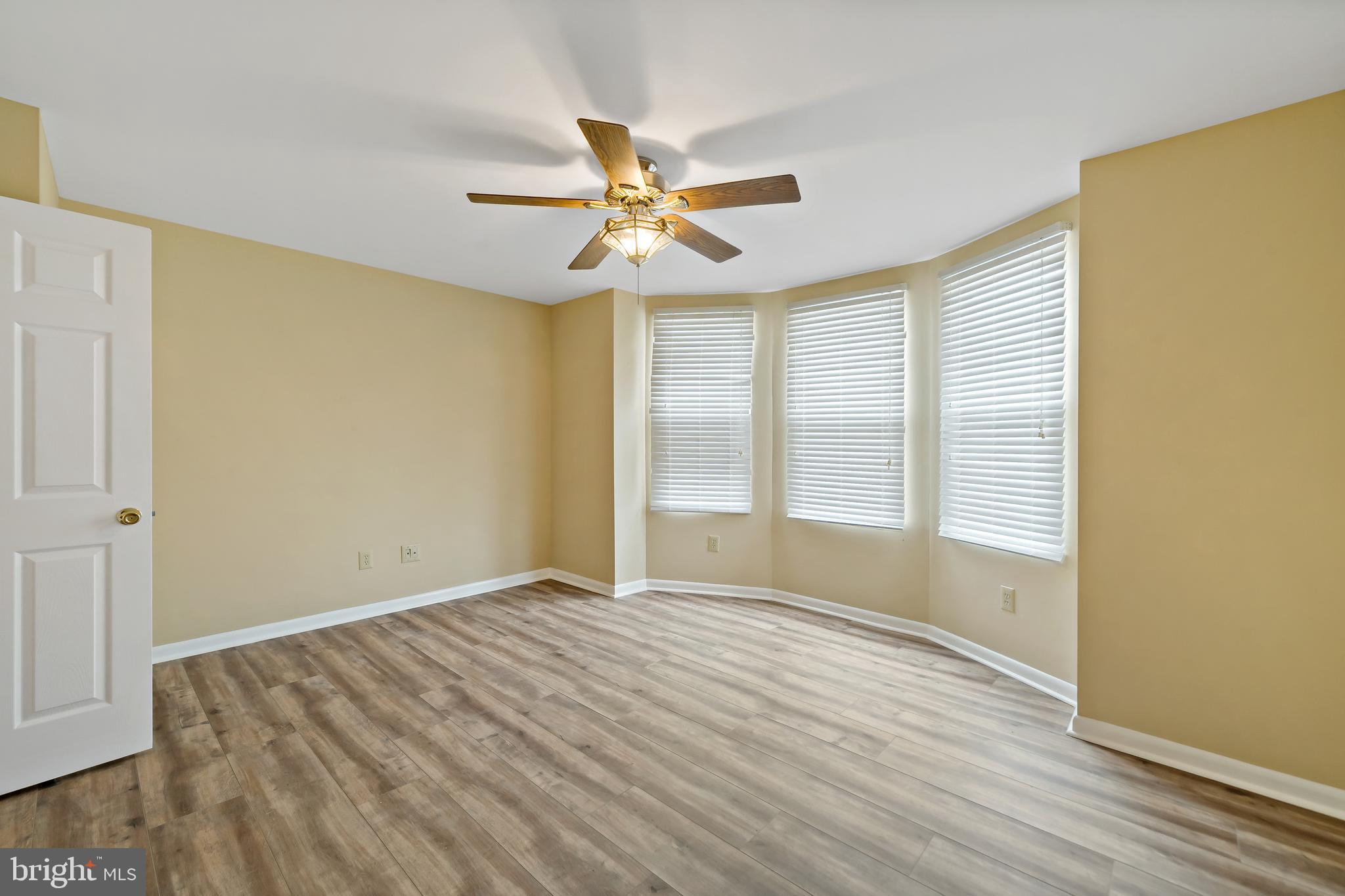 2537 South Broad Street, Unit 2 Philadelphia, PA 19148 - Photo 16 of 18 a view of empty room with wooden floor and fan