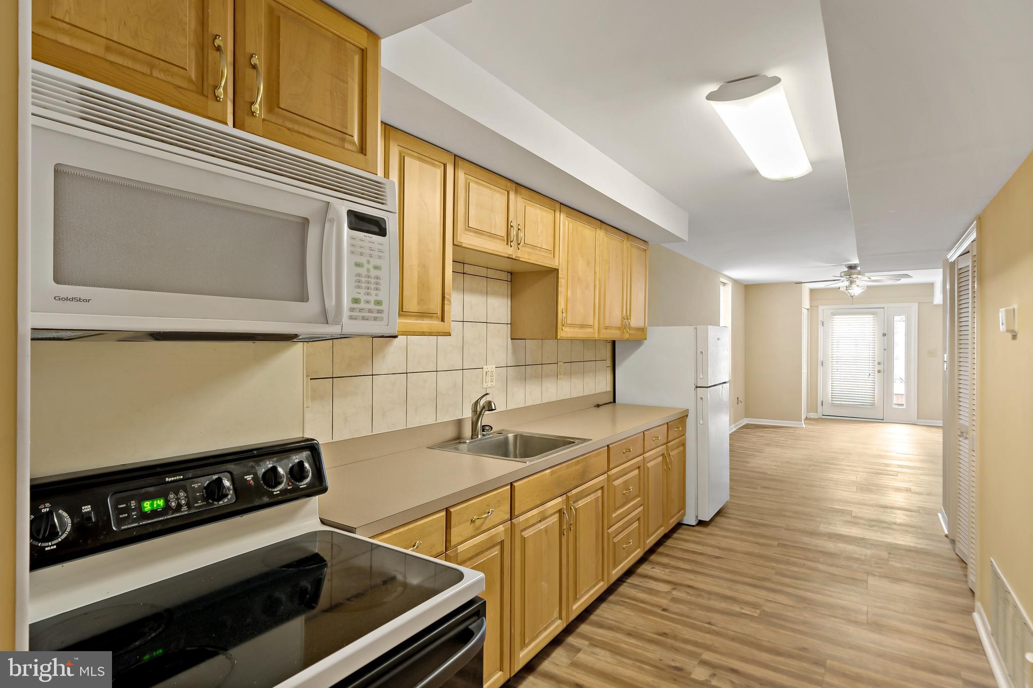 2537 South Broad Street, Unit 2 Philadelphia, PA 19148 - Photo 3 of 18 a kitchen with stainless steel appliances granite countertop a sink and a stove