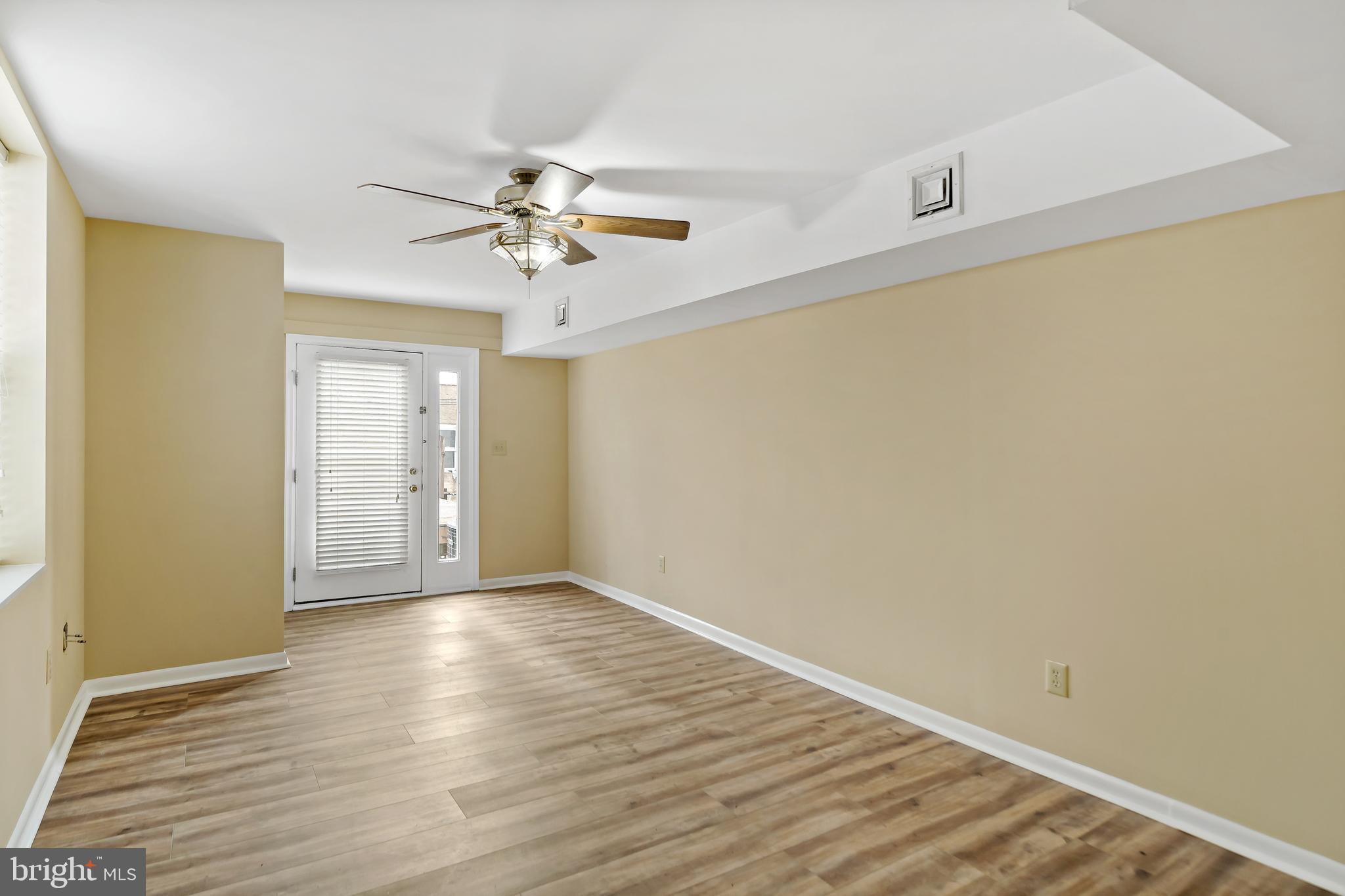 2537 South Broad Street, Unit 2 Philadelphia, PA 19148 - Photo 8 of 18 wooden floor in an empty room with a window