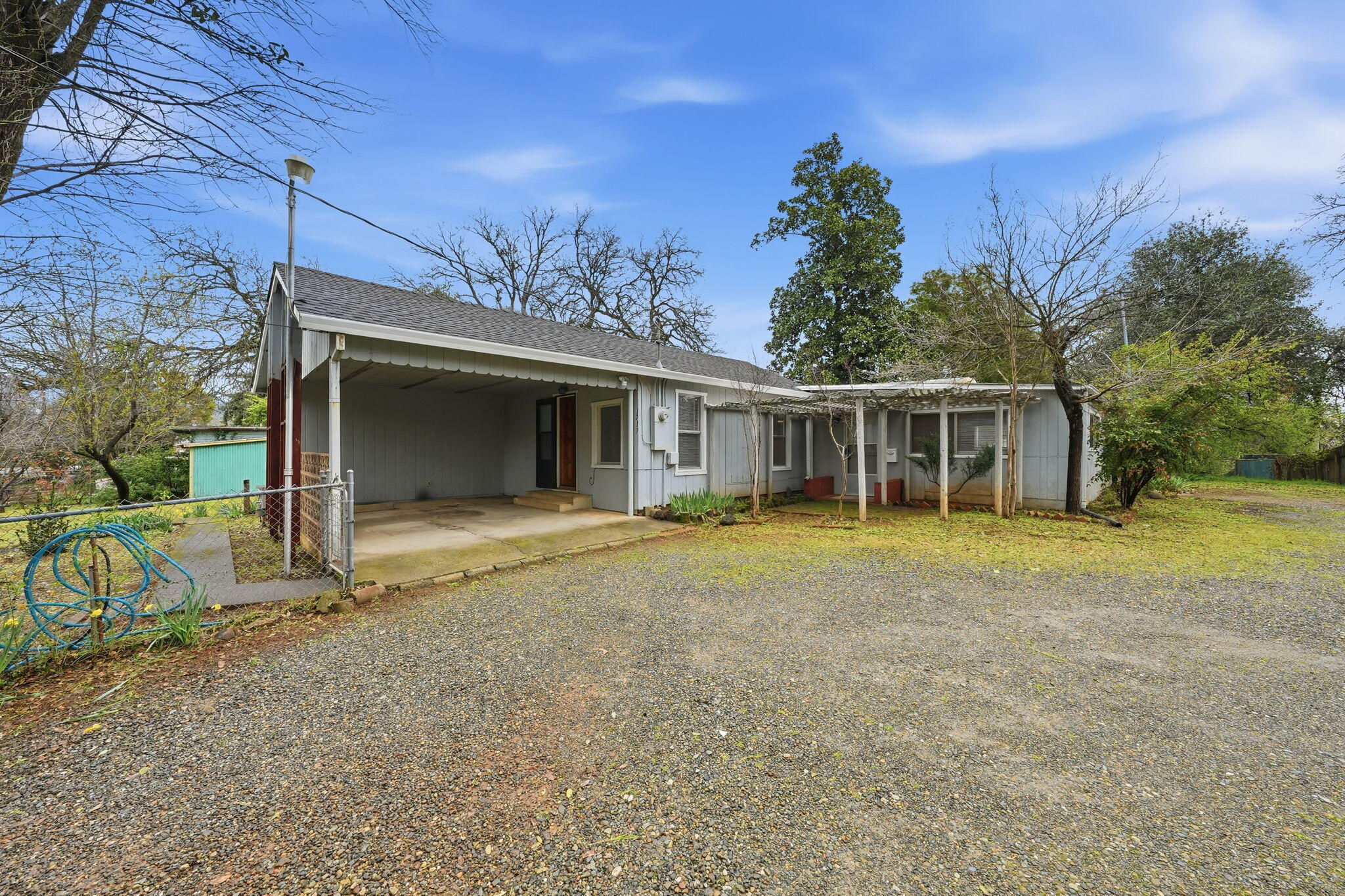 1717 Deer Creek Road Shasta Lake, CA 96019 - Photo 1 of 54 front view of a house with a garden