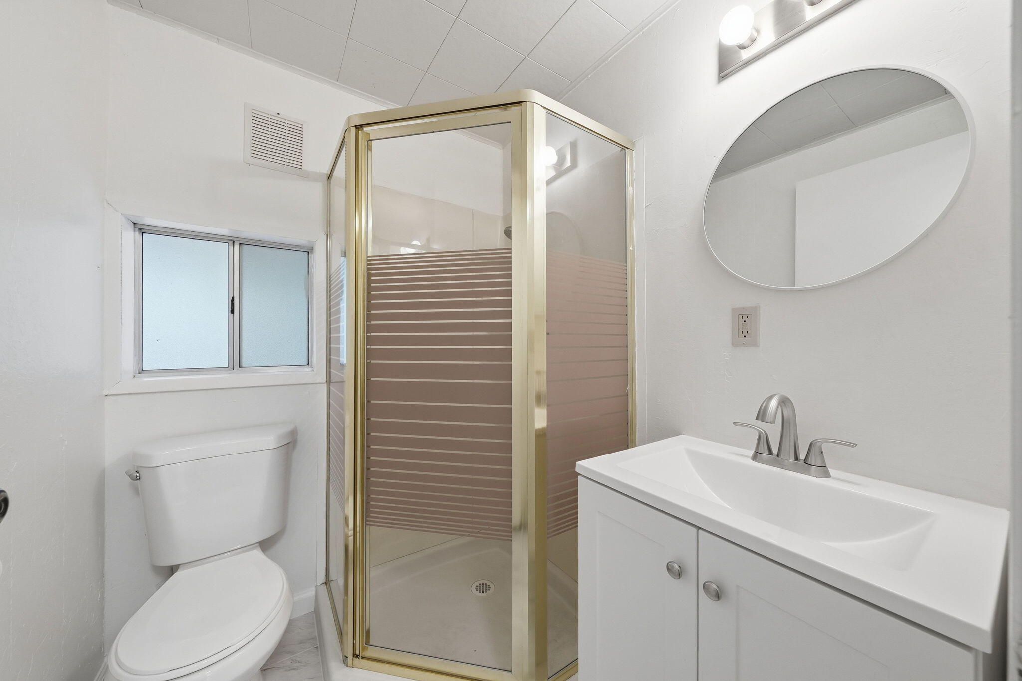 1717 Deer Creek Road Shasta Lake, CA 96019 - Photo 11 of 54 a bathroom with a toilet a sink and mirror