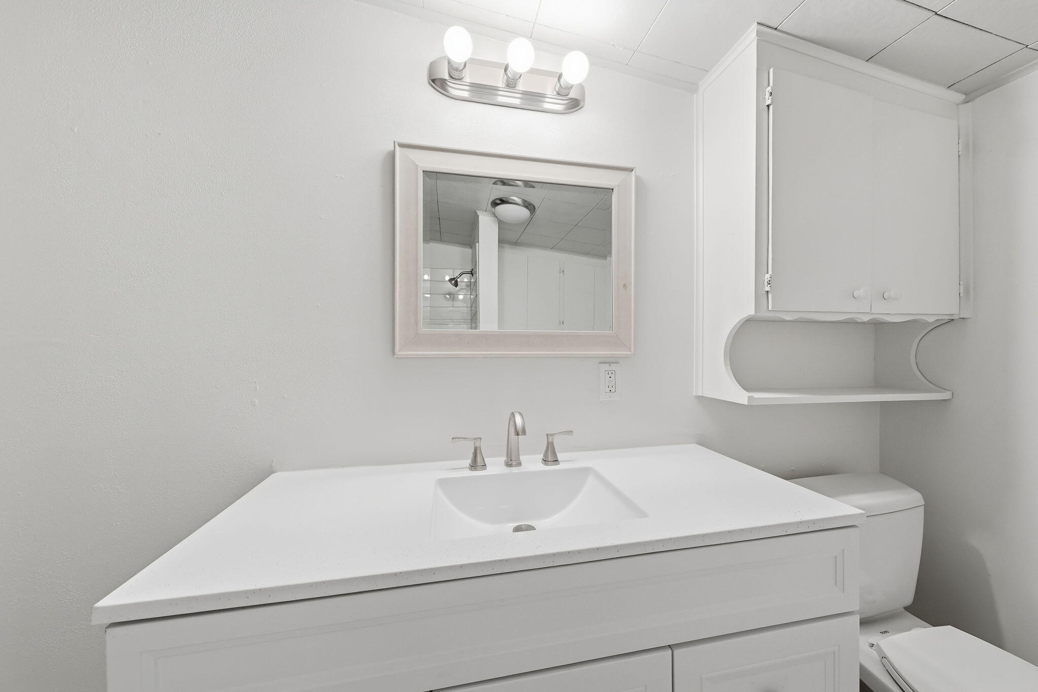1717 Deer Creek Road Shasta Lake, CA 96019 - Photo 18 of 54 a bathroom with a toilet a sink and mirror
