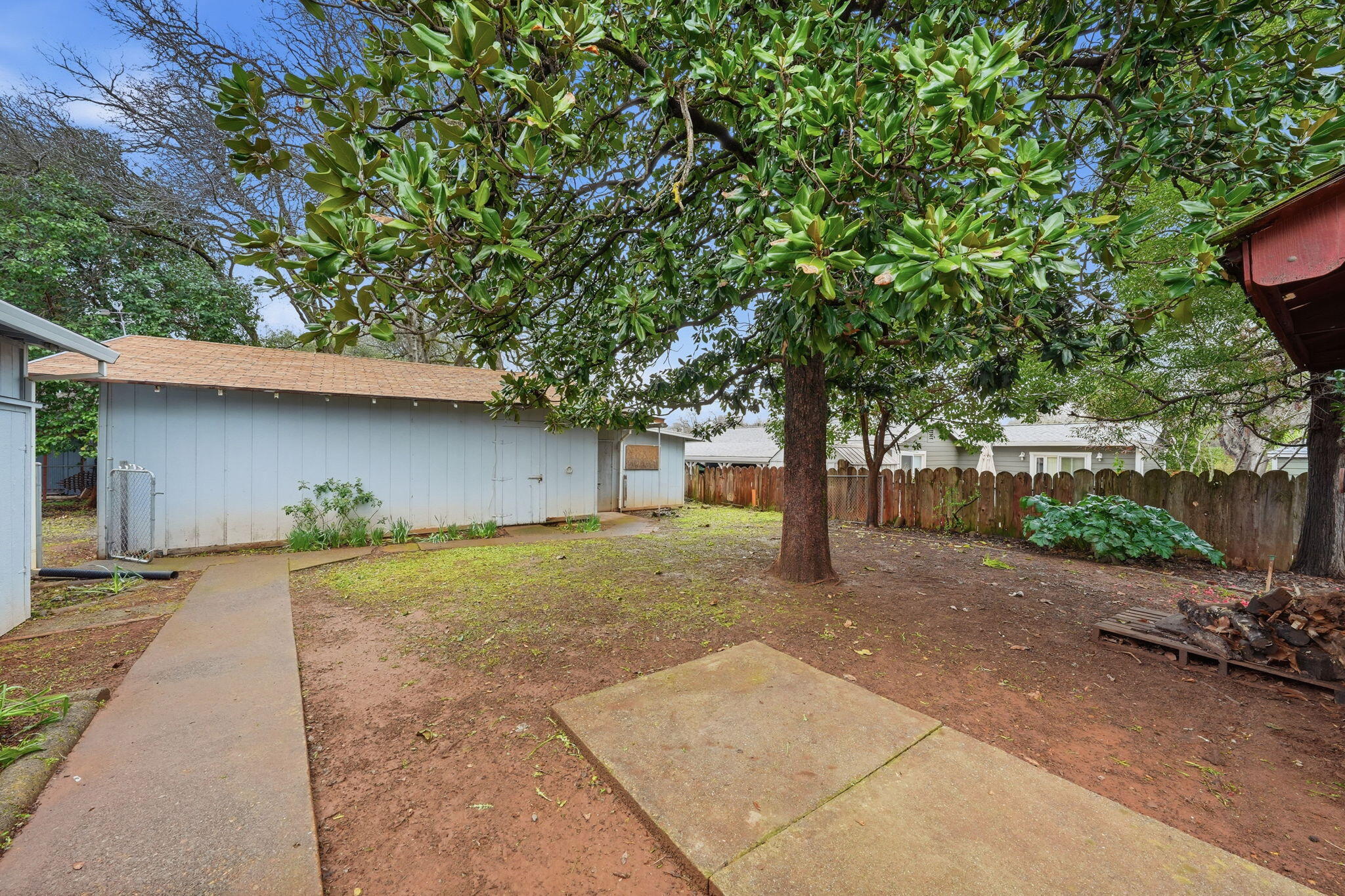 1717 Deer Creek Road Shasta Lake, CA 96019 - Photo 30 of 54 a house with a tree in front of it