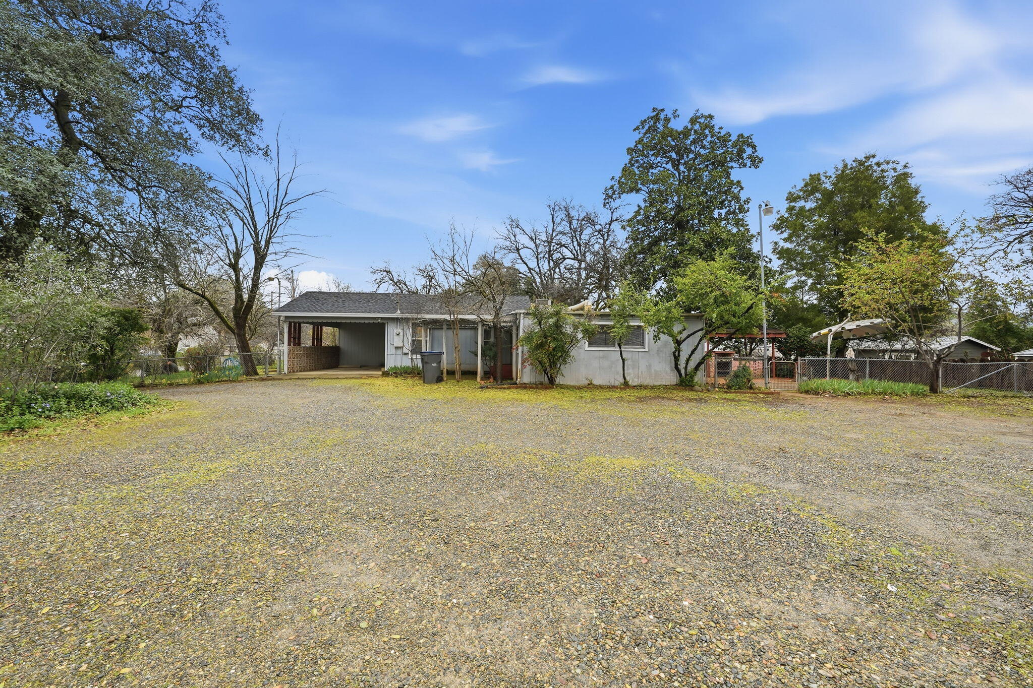 1717 Deer Creek Road Shasta Lake, CA 96019 - Photo 32 of 54 a front view of house with trees