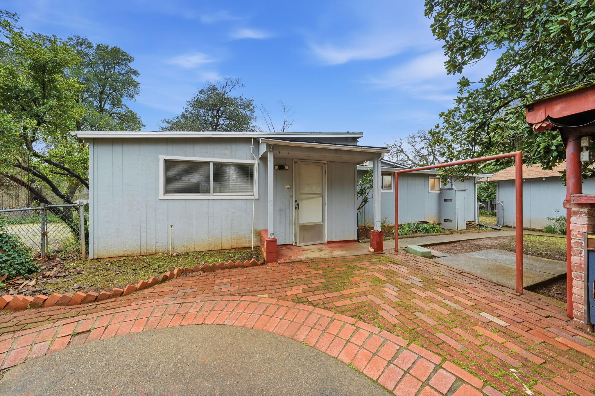 1717 Deer Creek Road Shasta Lake, CA 96019 - Photo 36 of 54 a front view of a house with a yard