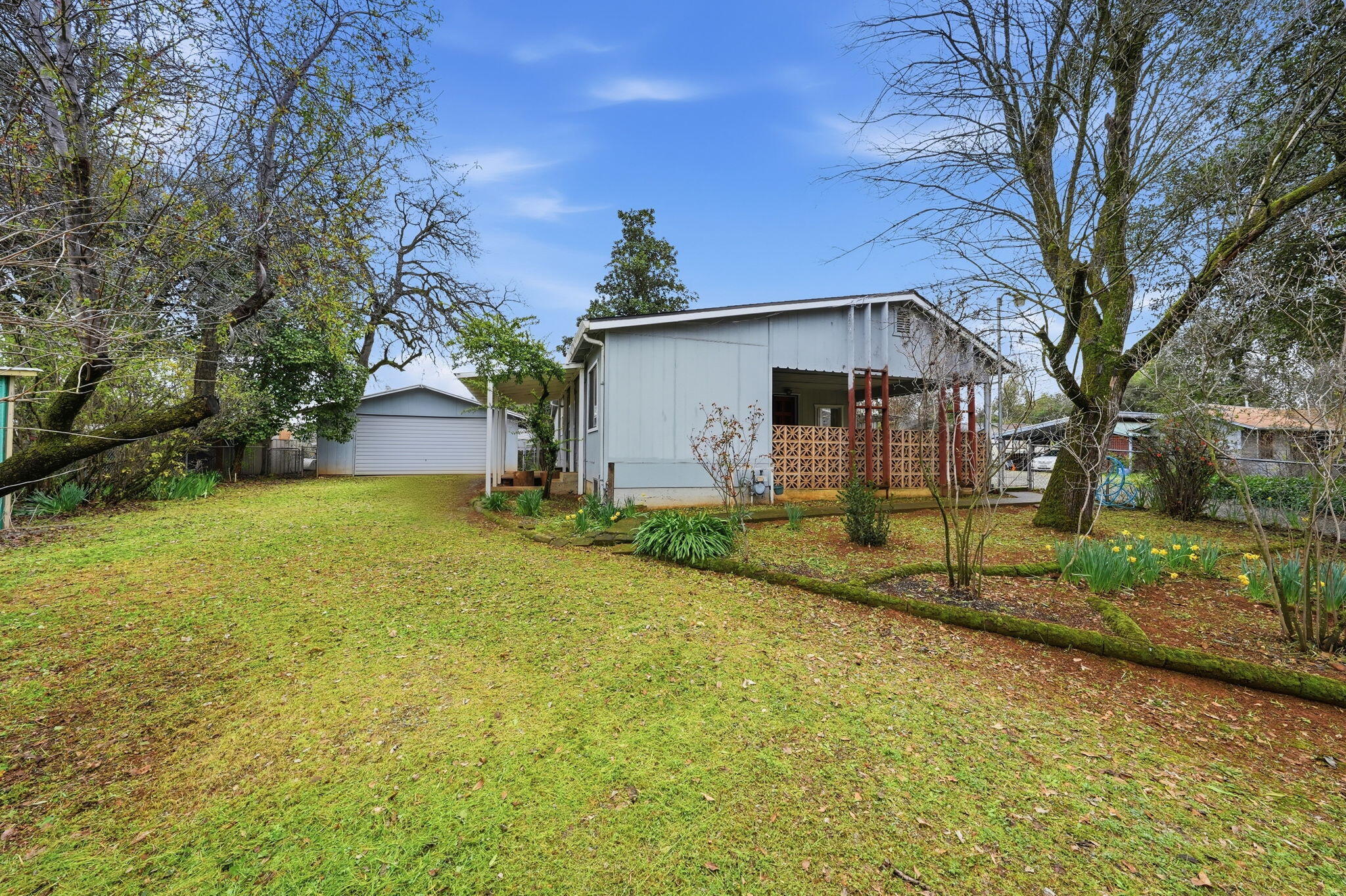 1717 Deer Creek Road Shasta Lake, CA 96019 - Photo 45 of 54 a front view of house with yard and green space
