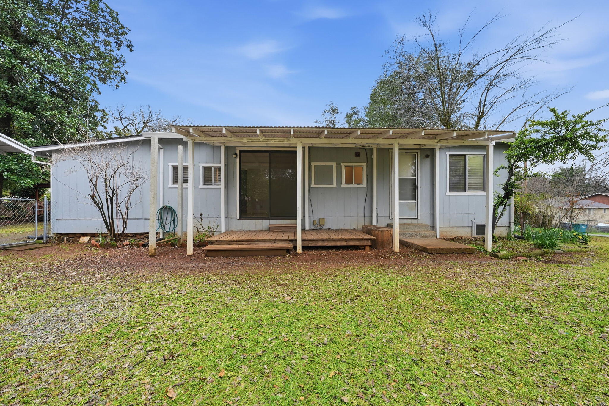 1717 Deer Creek Road Shasta Lake, CA 96019 - Photo 47 of 54 a view of a house with backyard and a tree