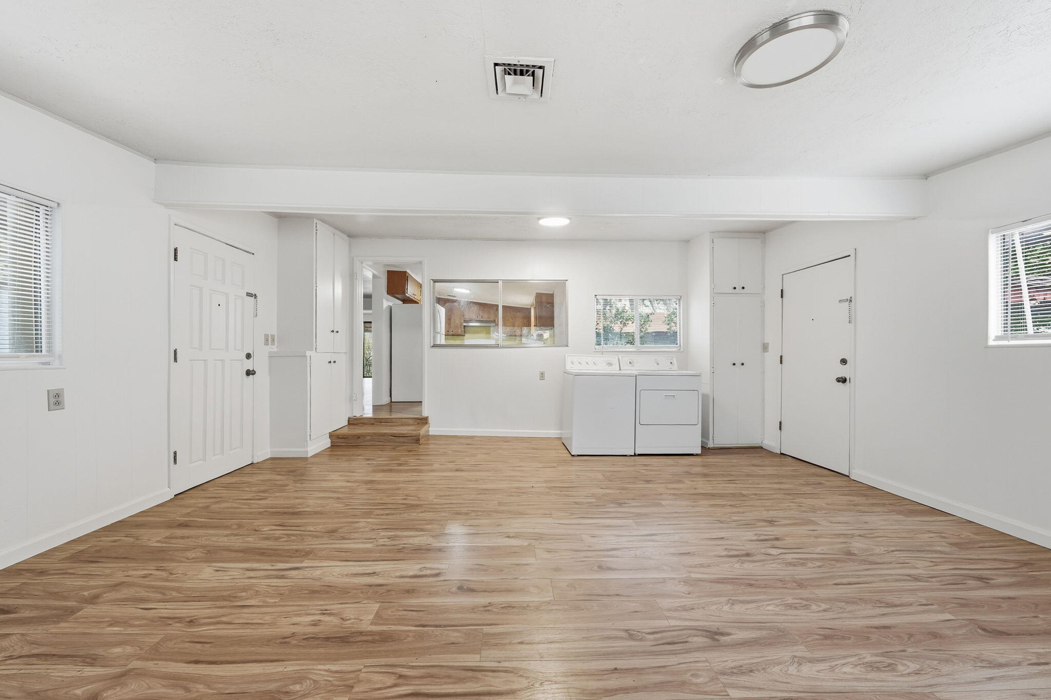 1717 Deer Creek Road Shasta Lake, CA 96019 - Photo 6 of 54 a view of an empty room with window and wooden floor