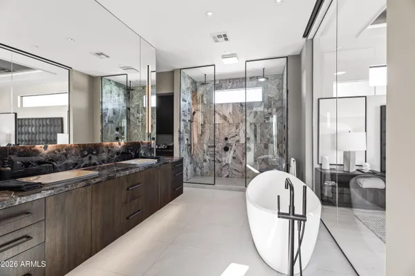 a large kitchen with kitchen island a sink stainless steel appliances and cabinets